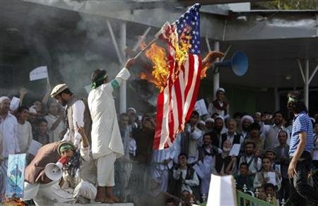 Muslim protestors burning U.S. flag
